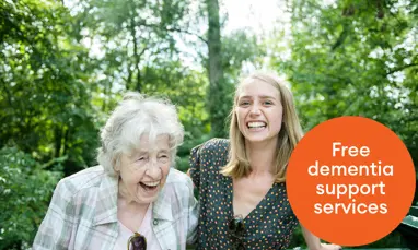 Older woman and younger woman laughing